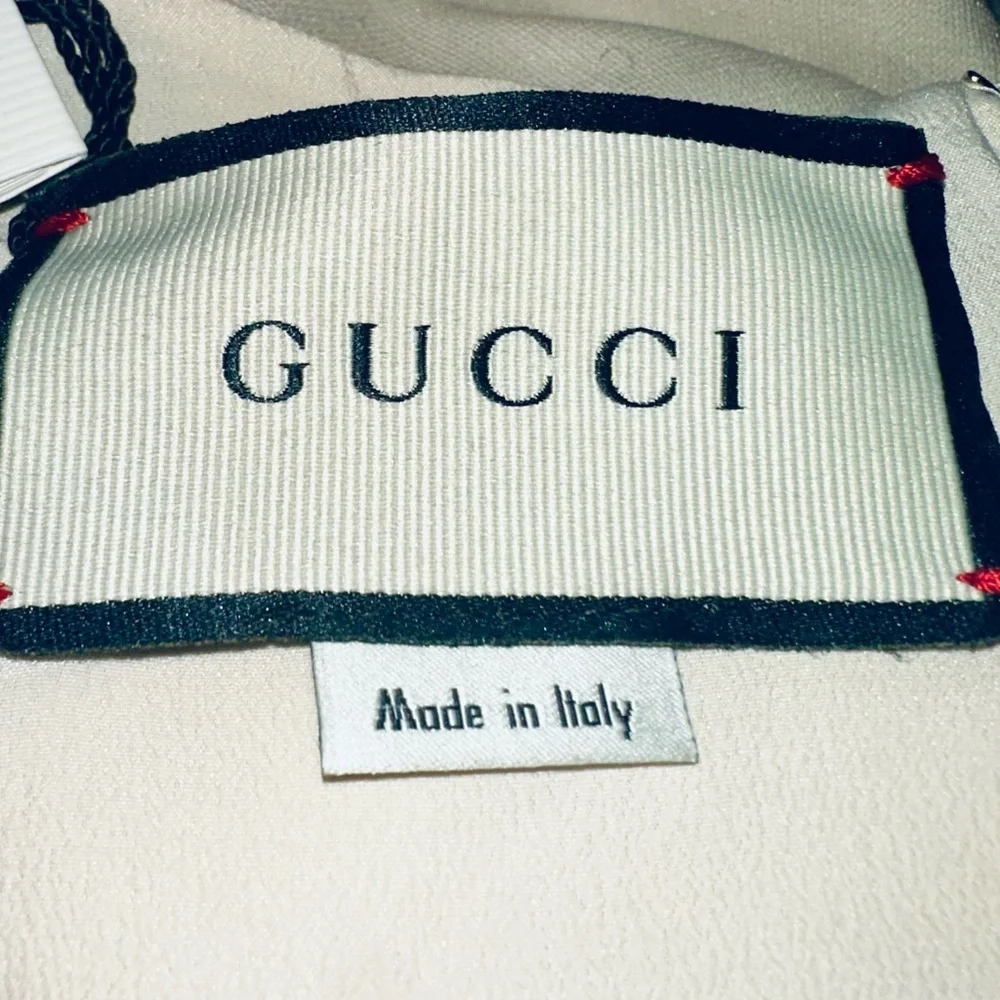 Gucci Red, Crème and Black Asymmetrical Dress with Gucci ivory dress cover. - Picture 7 of 15